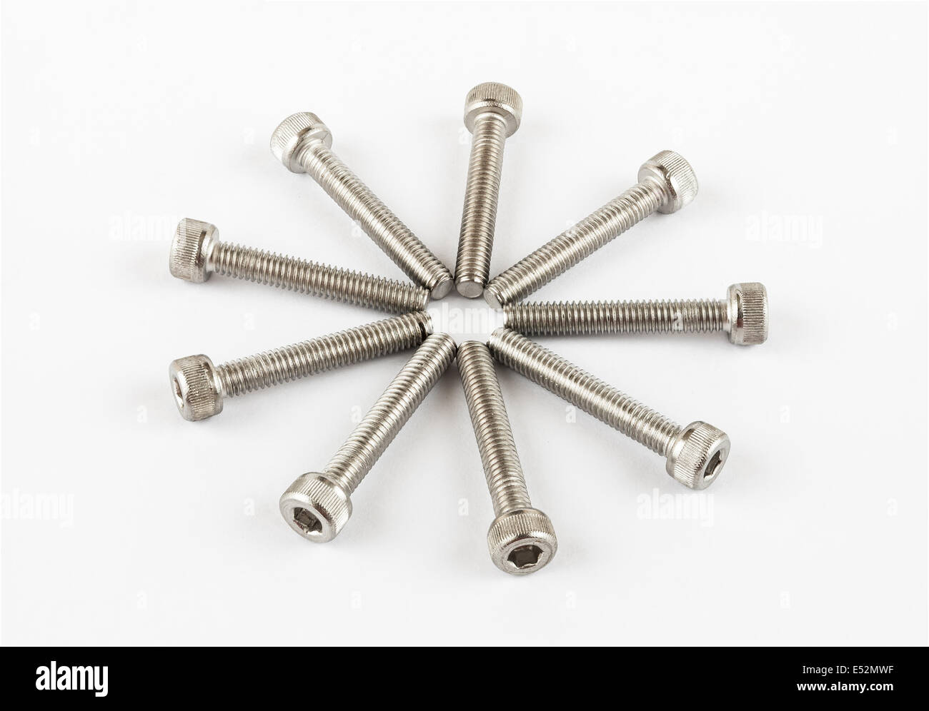 Round Pile of Stainless Steel Bolts. Stock Photo