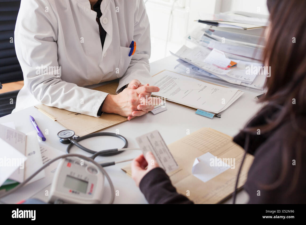 Doctor prescribes medication to patient Stock Photo Alamy