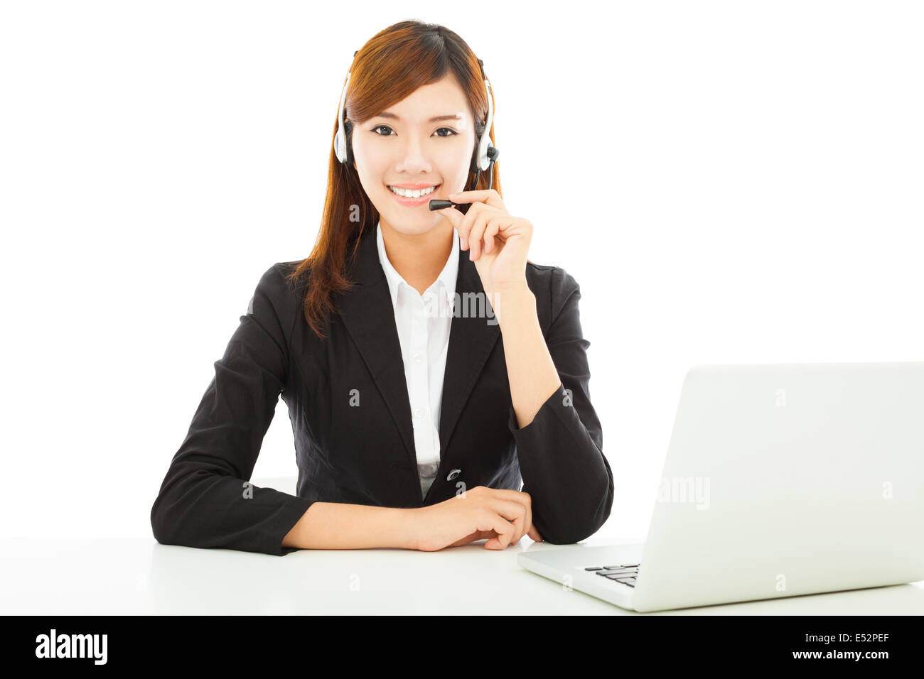 Young professional business woman with earphone and laptop Stock Photo