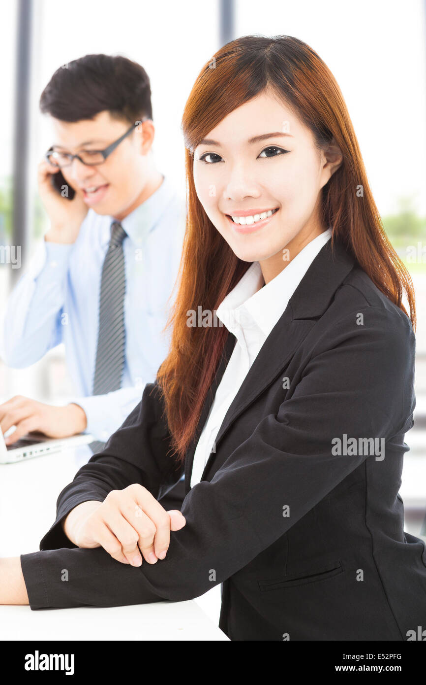 young business woman with colleague in office Stock Photo