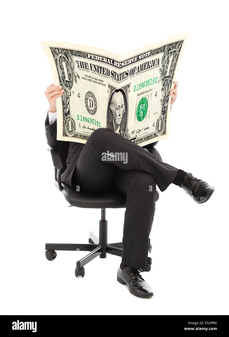 Business man sitting on a chair with American currency in hands Stock Photo