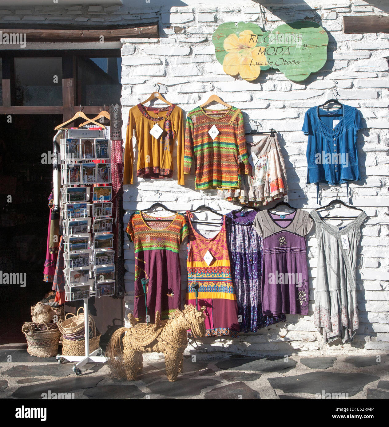 Clothes shop displaying traditional clothing, Capileira village, High Alpujarras, Sierra Nevada, Granada province, Spain Stock Photo