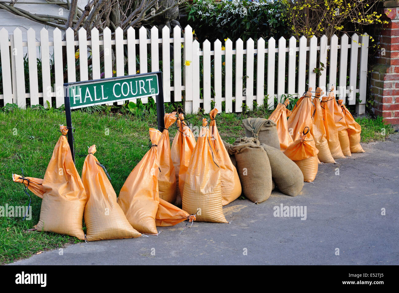 Flood prevention sandbags on side of road, The Green, Datchet, Berkshire, England, United Kingdom Stock Photo