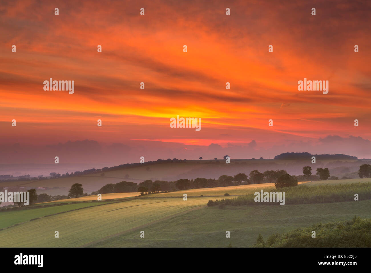 Sunset over the Vale of York from Thixendale on the edge of the East Yorkshire Wolds in mid-summer. Stock Photo