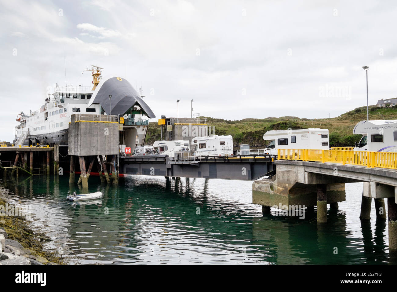 Motohomes loading on to ferry to Skye from pier in port of Tarbert Isle of Harris Outer Hebrides Western Isles Scotland UK Stock Photo