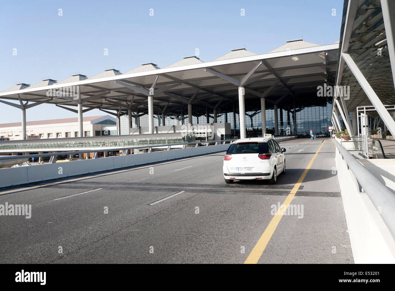 White taxi car arriving at Malaga airport, Spain Stock Photo