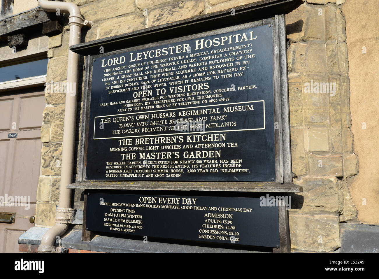 Visitor information sign at entrance to Lord Leycester Hospital, High Street, Warwick, Warwickshire, England, United Kingdom Stock Photo