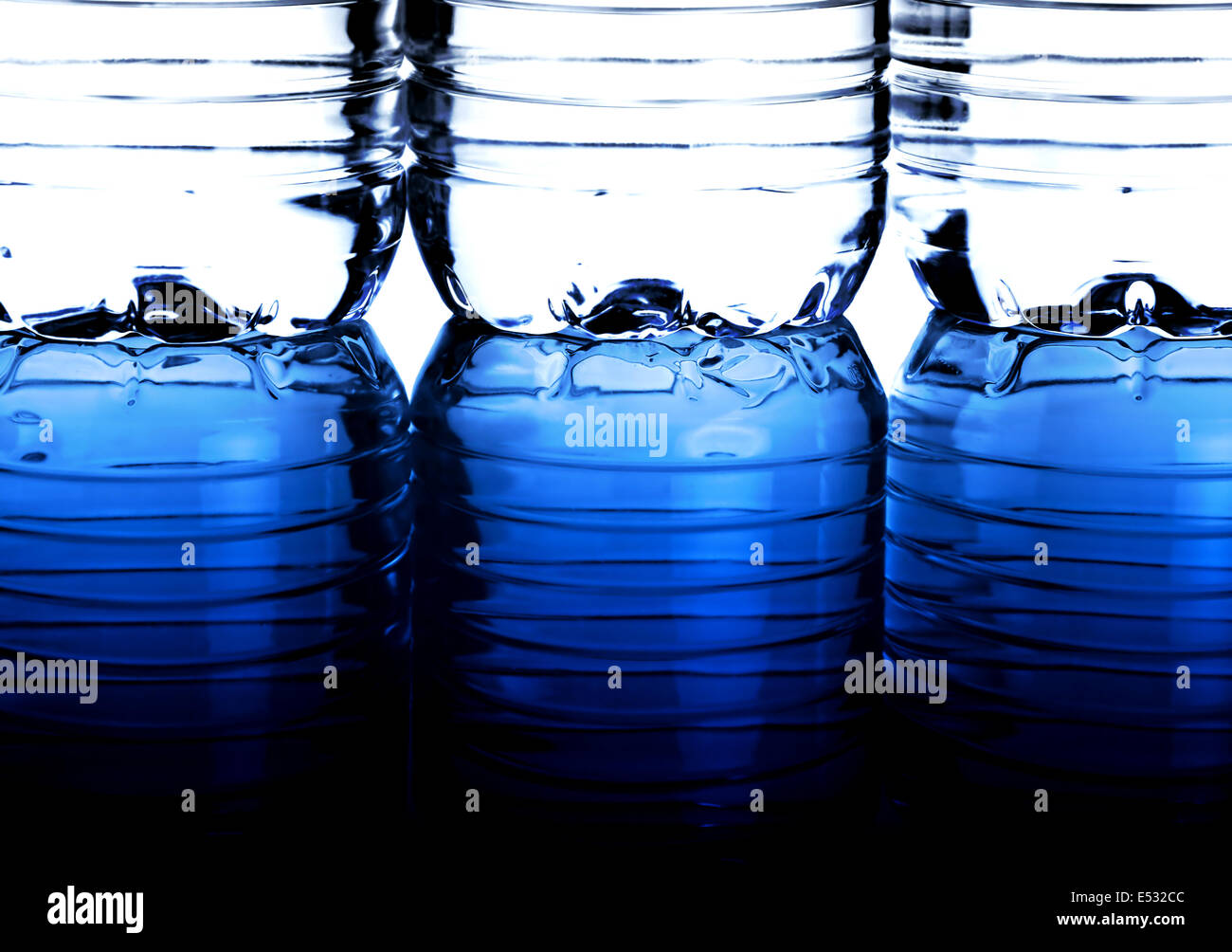 Three bottles of water with reflection Stock Photo Alamy