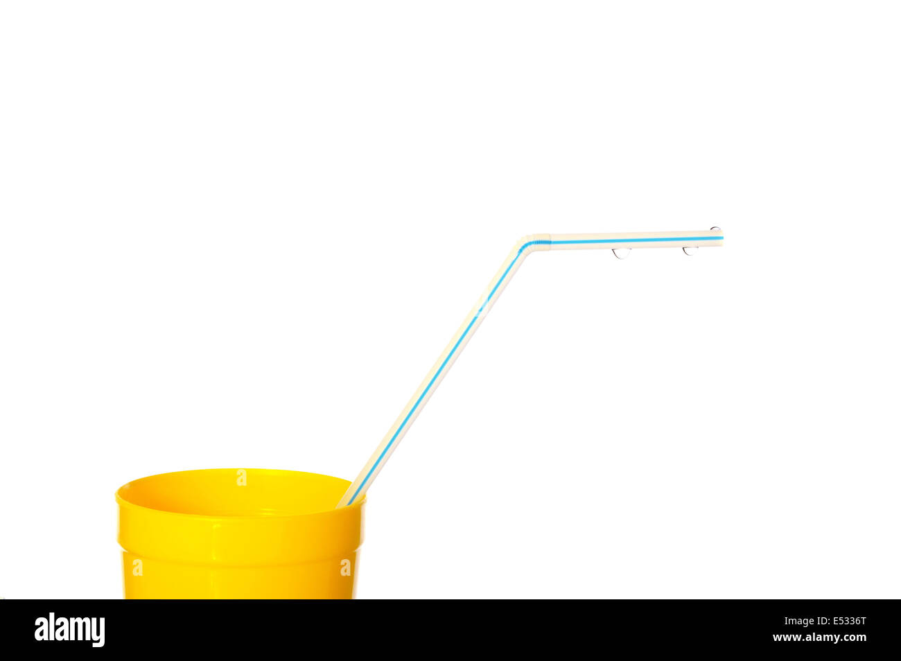 Yellow cup with blue drinking straw and water drops isolated over white Stock Photo