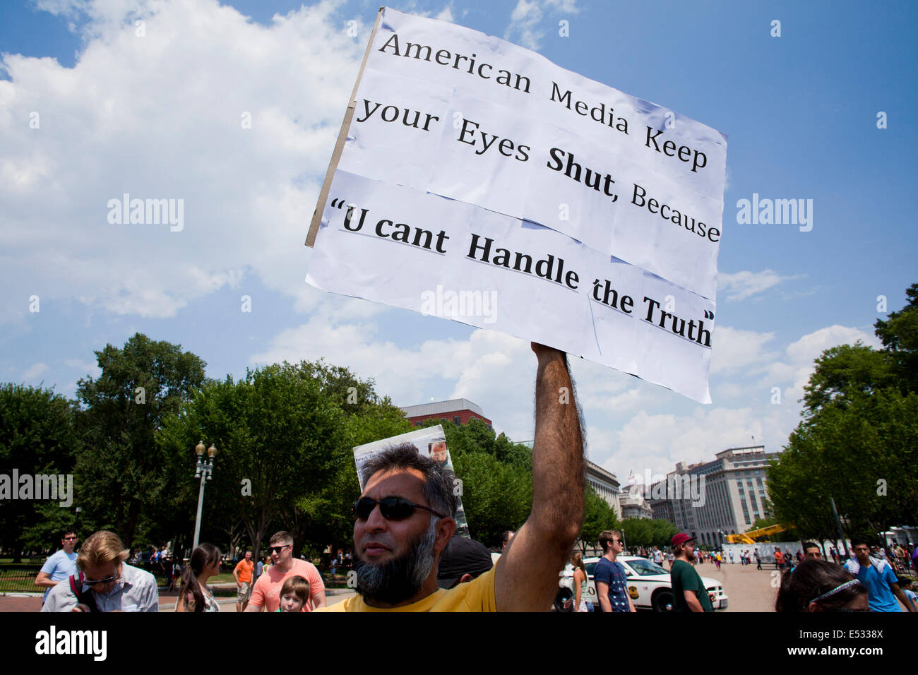 Man holding sign expressing criticism against American media - Washington, DC USA Stock Photo