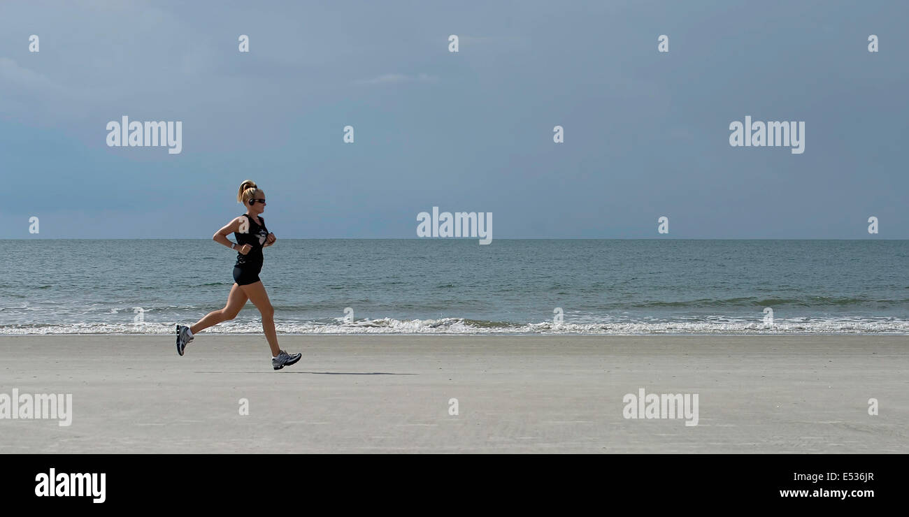 South Carolina Beach runner at sunrise Stock Photo