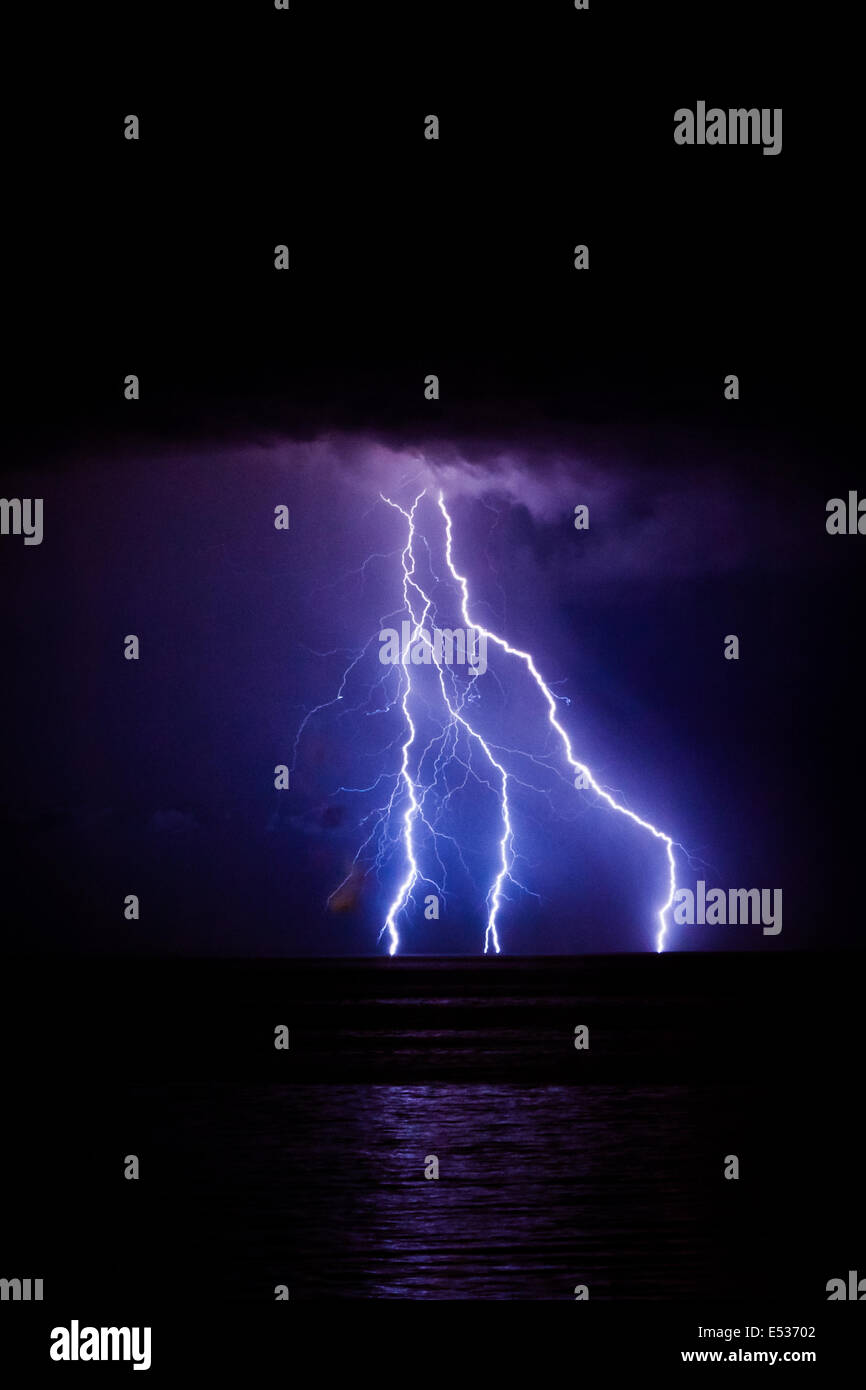 Brighton, UK. 19 July 2014. Lightning strikes just east of the Brighton Pier during a summer lightning storm. Stormy weather is predicted for most of the weekend. Credit:  PhotoMadly/Alamy Live News Stock Photo