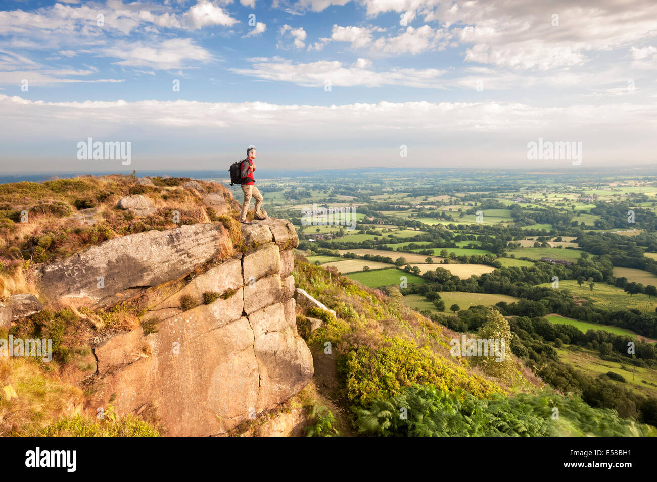 A Rambler looking across the Cheshire Plains from Bosley Cloud, Congleton, Cheshire. UK Stock Photo