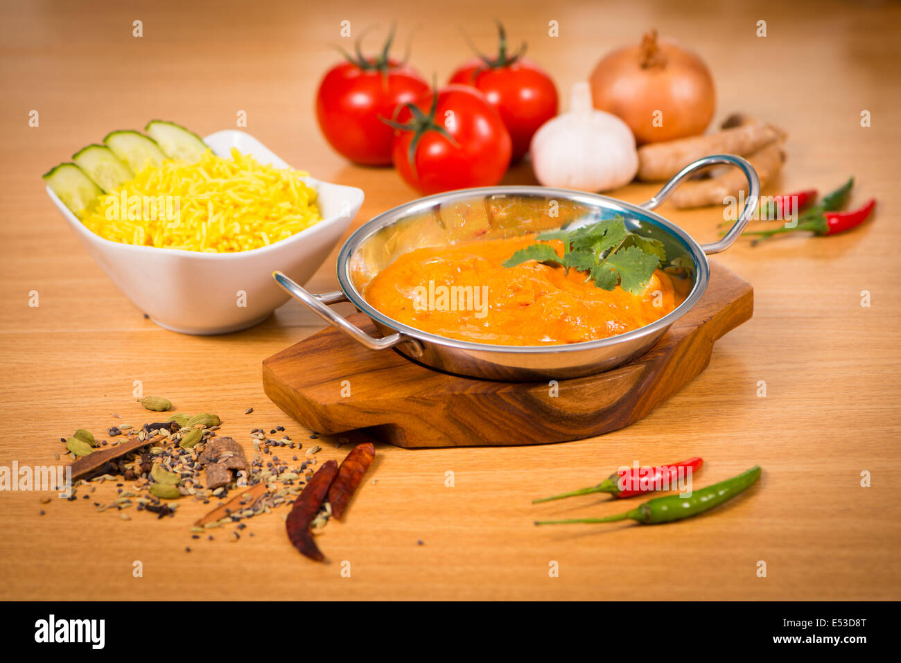 Indian food chicken jalfrezi curry in balti dish decoration set of