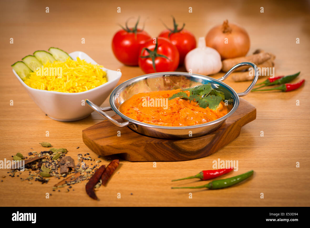 Indian food chicken jalfrezi curry in balti dish decoration set of  vegetables Stock Photo - Alamy