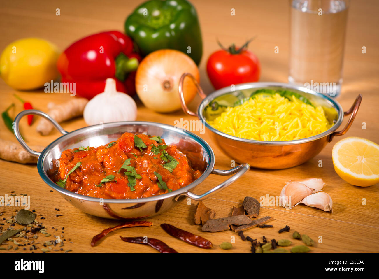 Indian food chicken jalfrezi curry in balti dish decoration set of vegetables Stock Photo