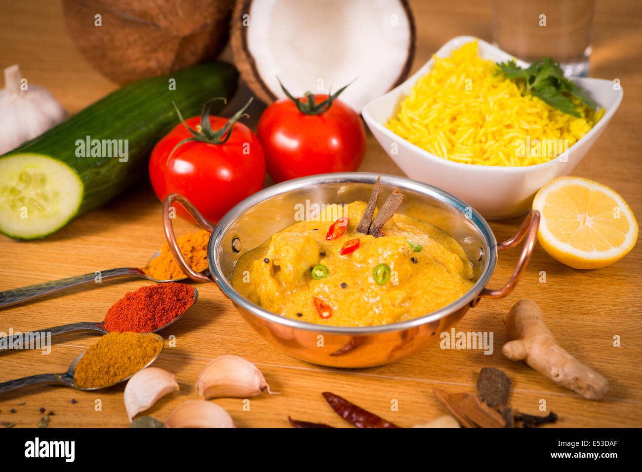 Indian food chicken jalfrezi curry in balti dish decoration set of  vegetables Stock Photo - Alamy