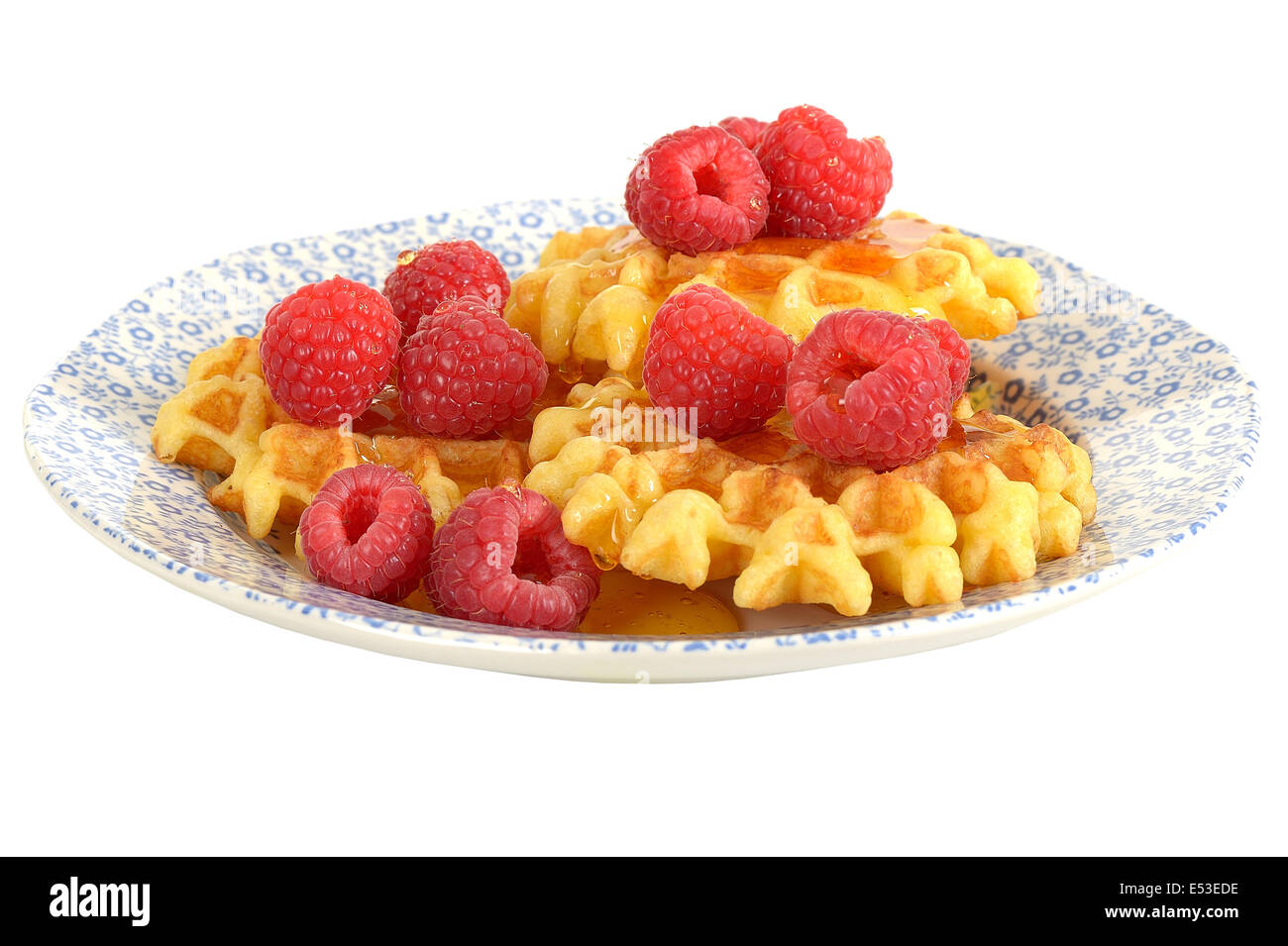Healthy Fresh Breakfast Meal Belgian Waffles With Ripe Juicy Sweet Raspberries Isolated Against A White Background With A Clipping Path And No People Stock Photo