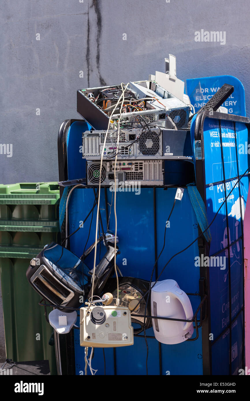Recycling of old electronic goods tv, kettle, toaster, computer, telephone, at a rubbish dump on UCC campus, Cork, Ireland. Stock Photo