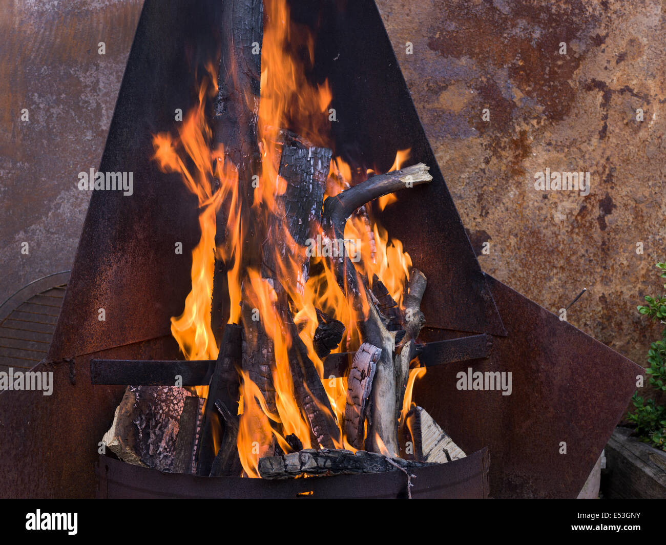 metal iron fireplace fire place garden grill hot wood burn burning Stock Photo