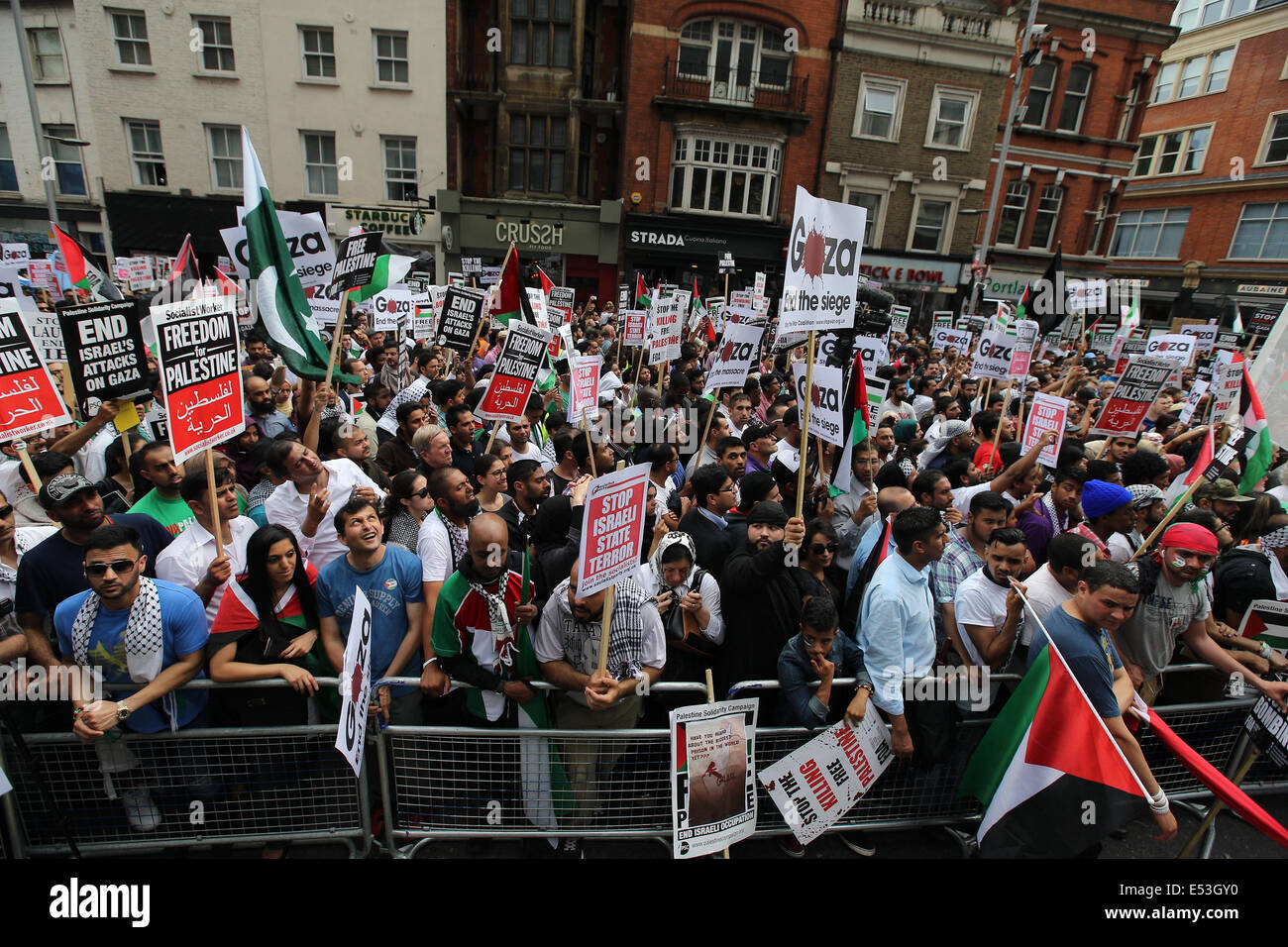 London, United Kingdom, 19th July, 2014. Palestinians and their supporters in their tens of thousands march from Downing Street to the Israeli Embassy to protest the ongoing conflict in Gaza.  Credit:  Mario Mitsis / Alamy Live News Stock Photo