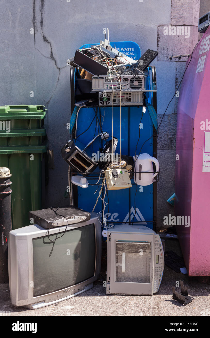 Recycling of old electronic goods tv, kettle, toaster, computer, telephone, at a rubbish dump on UCC campus, Cork, Ireland. Stock Photo