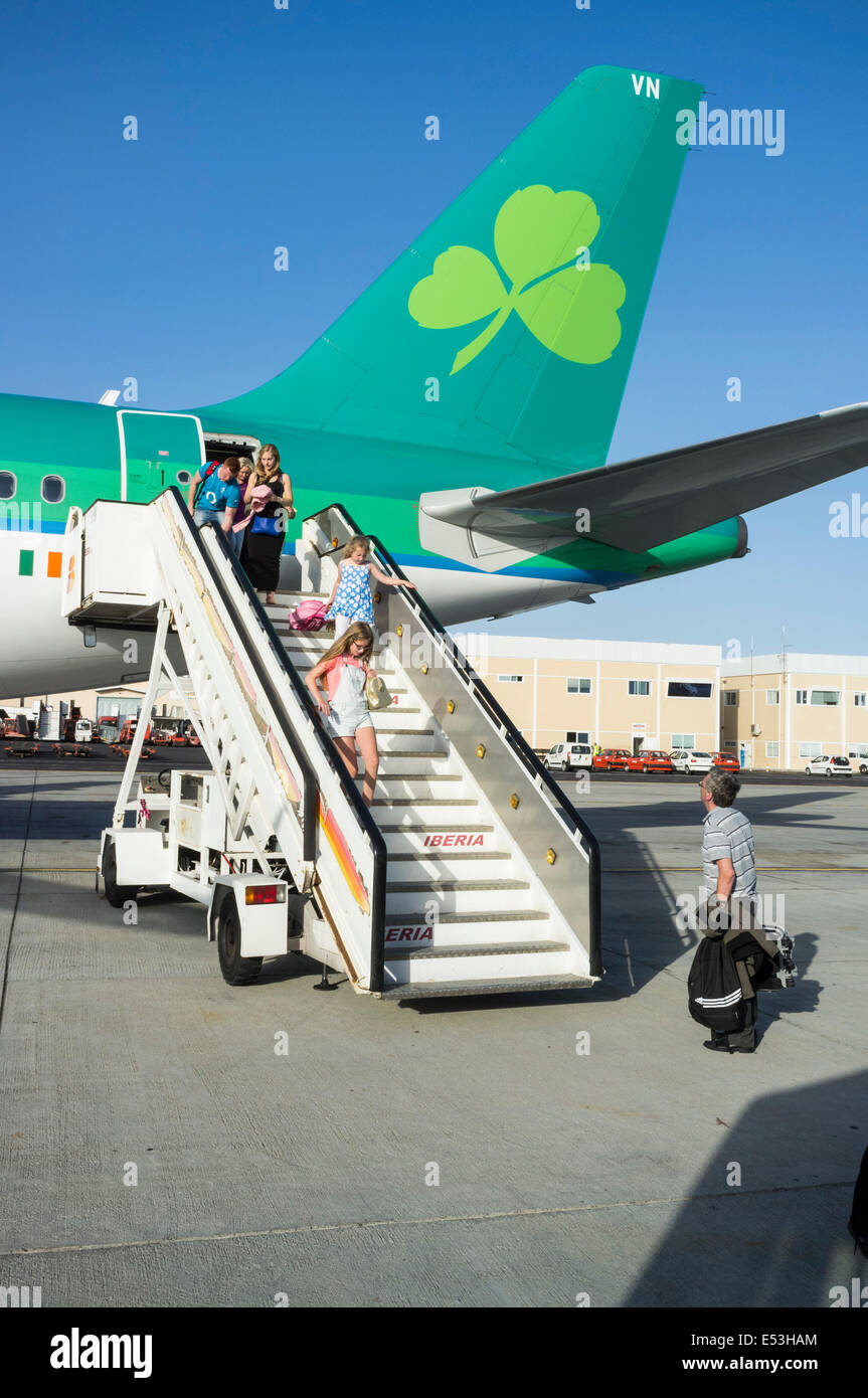 Rear steps and tail of an Aer Lingus Airbus 320 on the tarmac disembarking passengers at Tenerife Sur airport. Canary Islands, S Stock Photo