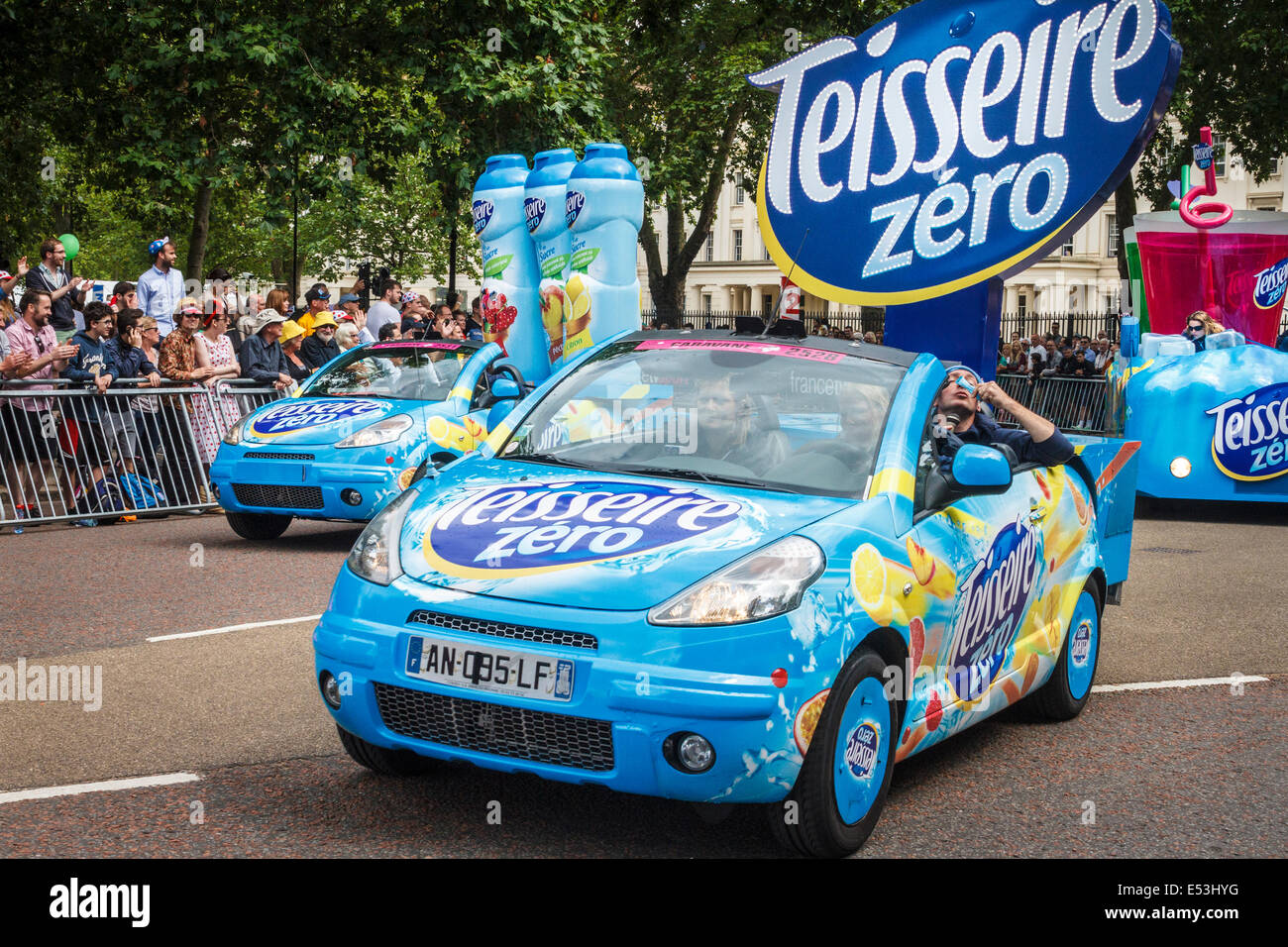 Sponsors' vehicles precede the arrival of the riders in the Tour De France 2014 third stage in