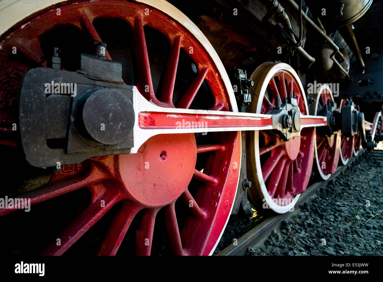 Old steam engine locomotive propulsion mechanism wheels machinery power strength strong powerful steel Stock Photo