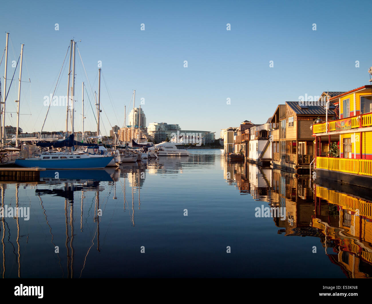 A serene view of boats and houseboats moored at Fisherman's Wharf in Victoria, British Columbia, Canada. Stock Photo