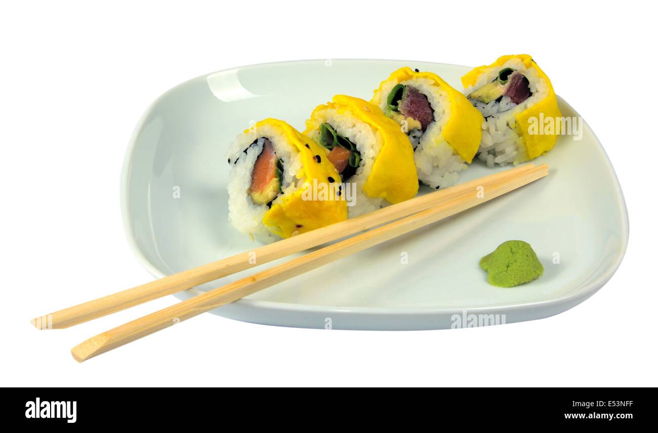 Sushi with tuna and scrambled eggs on a plate with chopstick and wasabi Stock Photo