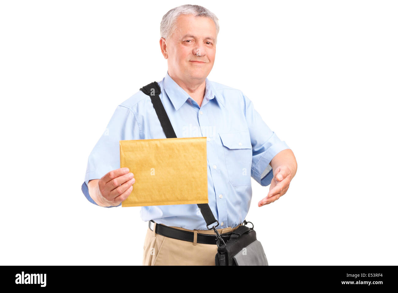 Mature mailman holding an envelope Stock Photo