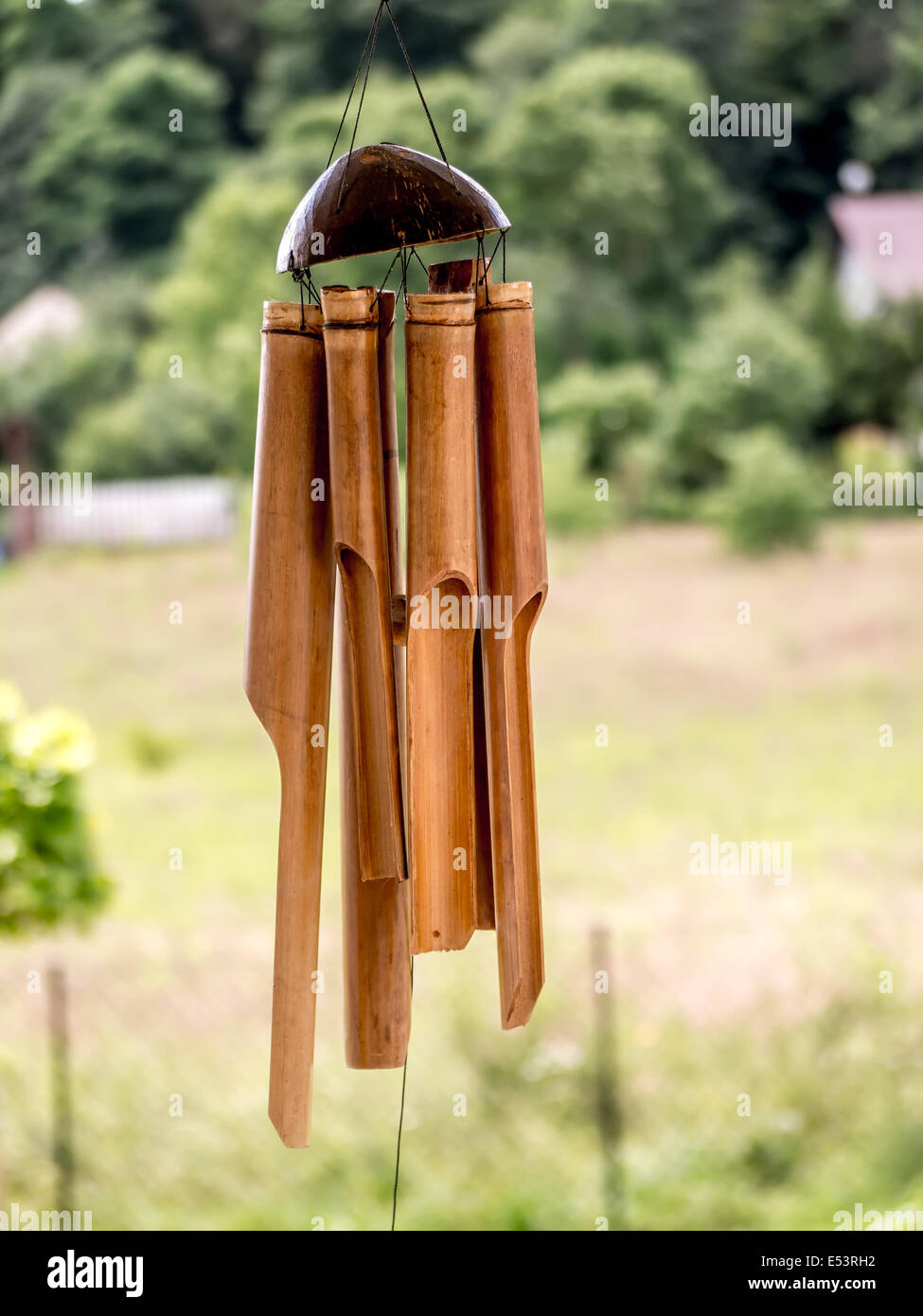 Bamboo wind chimes hung outside Stock Photo