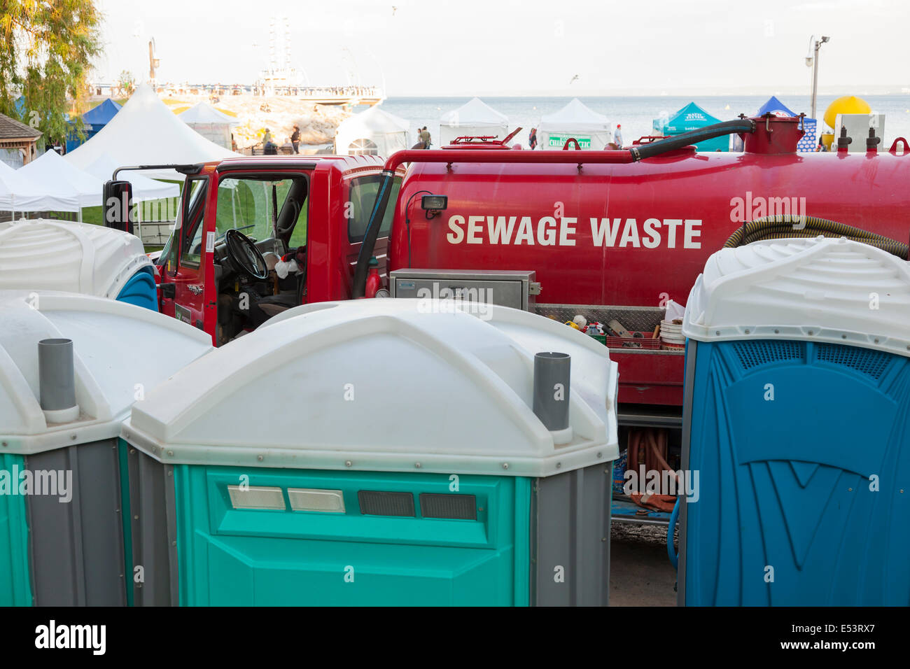 A sewage waste truck and Port-a-Pottys at the 'Sound of Music Festival' at Spencer Smith Park in Burlington, Ontario, Canada. Stock Photo