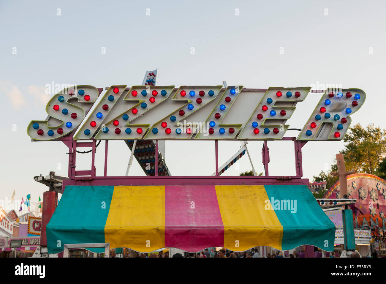 Signage for a ride called 'Sizzler' at the 'Sound of Music Festival' at Spencer Smith Park in Burlington, Ontario, Canada. Stock Photo