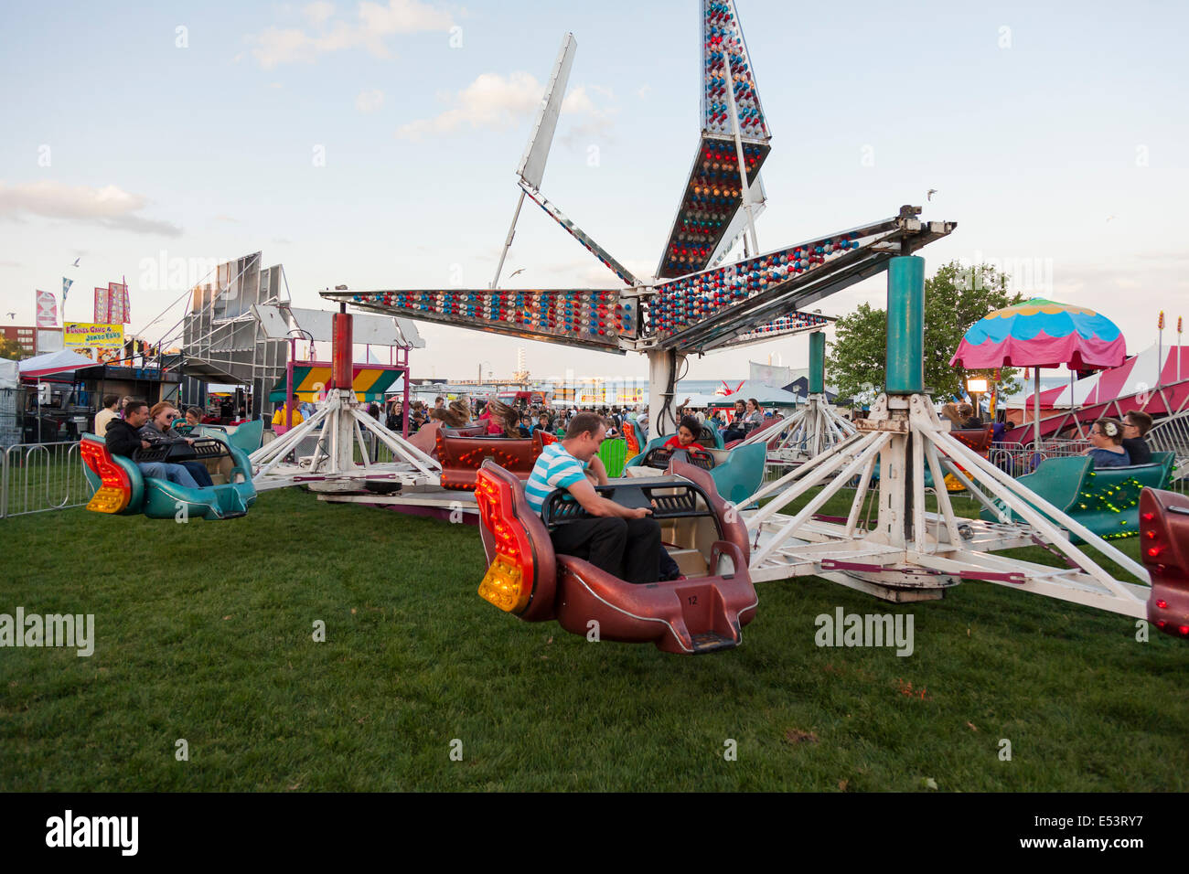 People enjoying the 'Sizzler' ride at the 'Sound of Music Festival' at Spencer Smith Park in Burlington, Ontario, Canada. Stock Photo