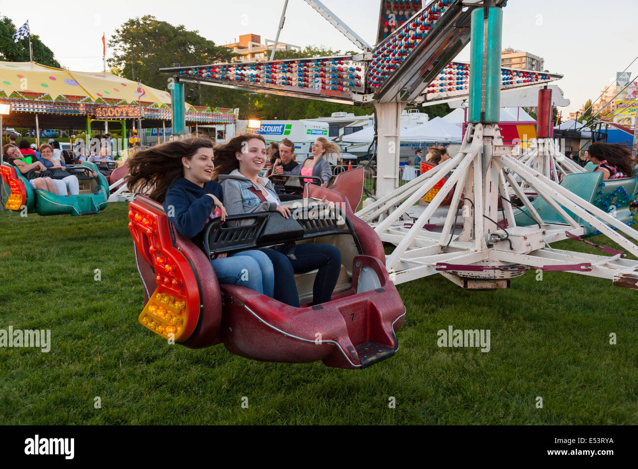 People enjoying the 'Sizzler' ride at the 'Sound of Music Festival' at Spencer Smith Park in Burlington, Ontario, Canada. Stock Photo