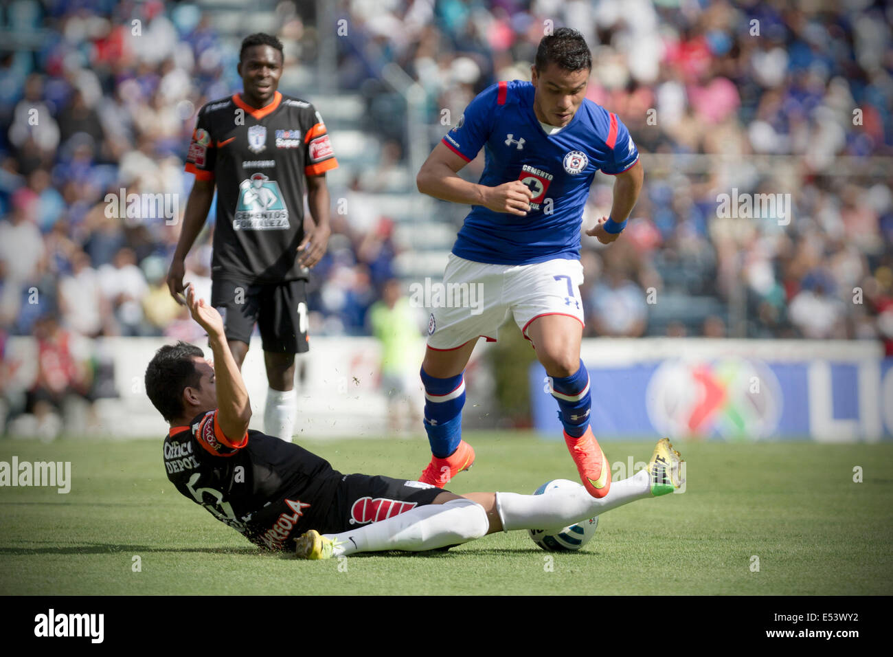 Mexico City, Mexico. 19th July, 2014. Cruz Azul's Pablo Barrera (R) vies for the ball with Pachuca's Daniel Arreola during their match of the MX League Opening Tournament held at Azul Stadium in Mexico City, capital of Mexico, on July 19, 2014. Credit:  Alejandro Ayala/Xinhua/Alamy Live News Stock Photo