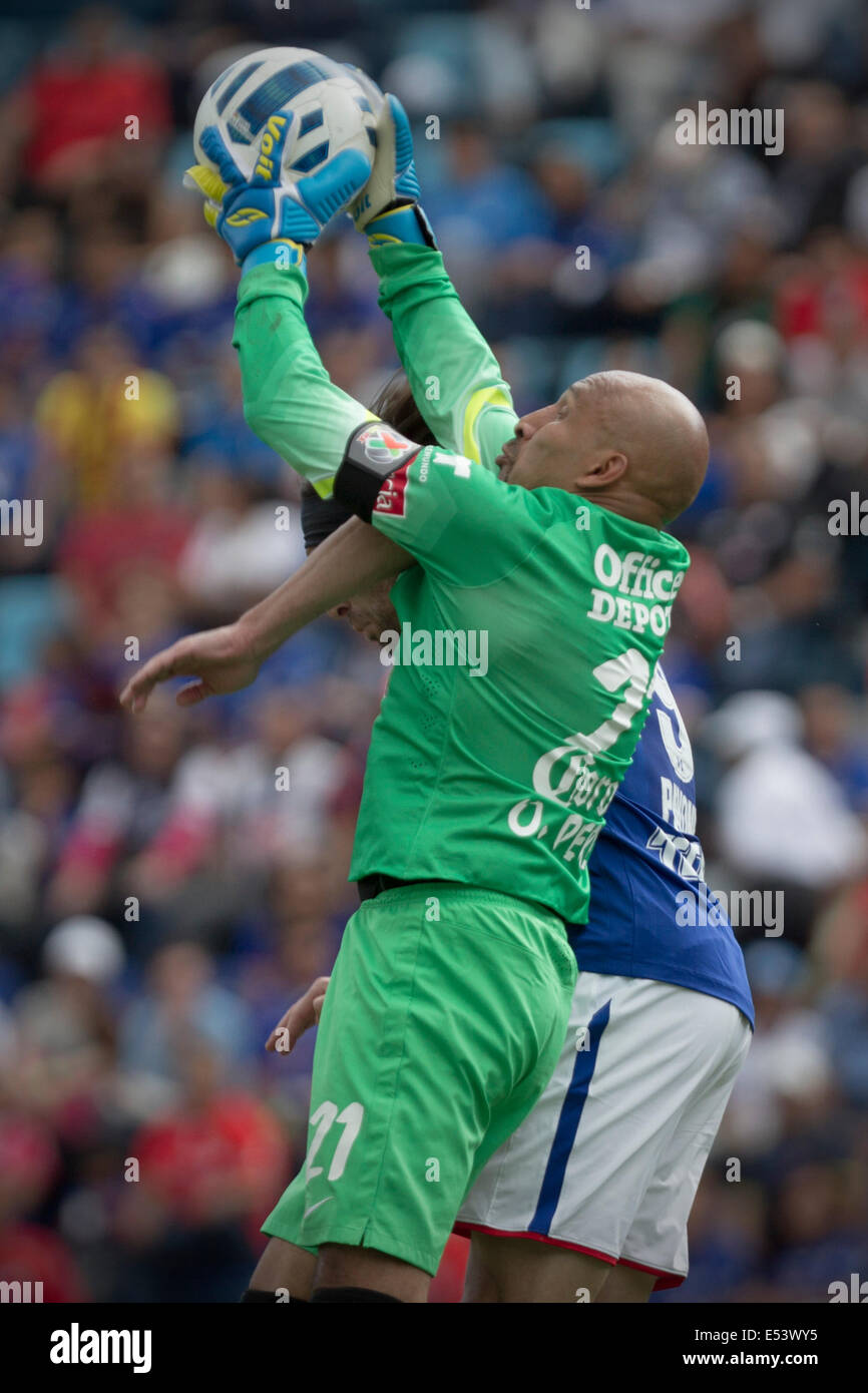 Mexico City, Mexico. 19th July, 2014. Pachuca's goalie Oscar Perez (front) vies with Cruz Azul's Mariano Pavone during their match of the MX League Opening Tournament held at Azul Stadium in Mexico City, capital of Mexico, on July 19, 2014. Credit:  Alejandro Ayala/Xinhua/Alamy Live News Stock Photo