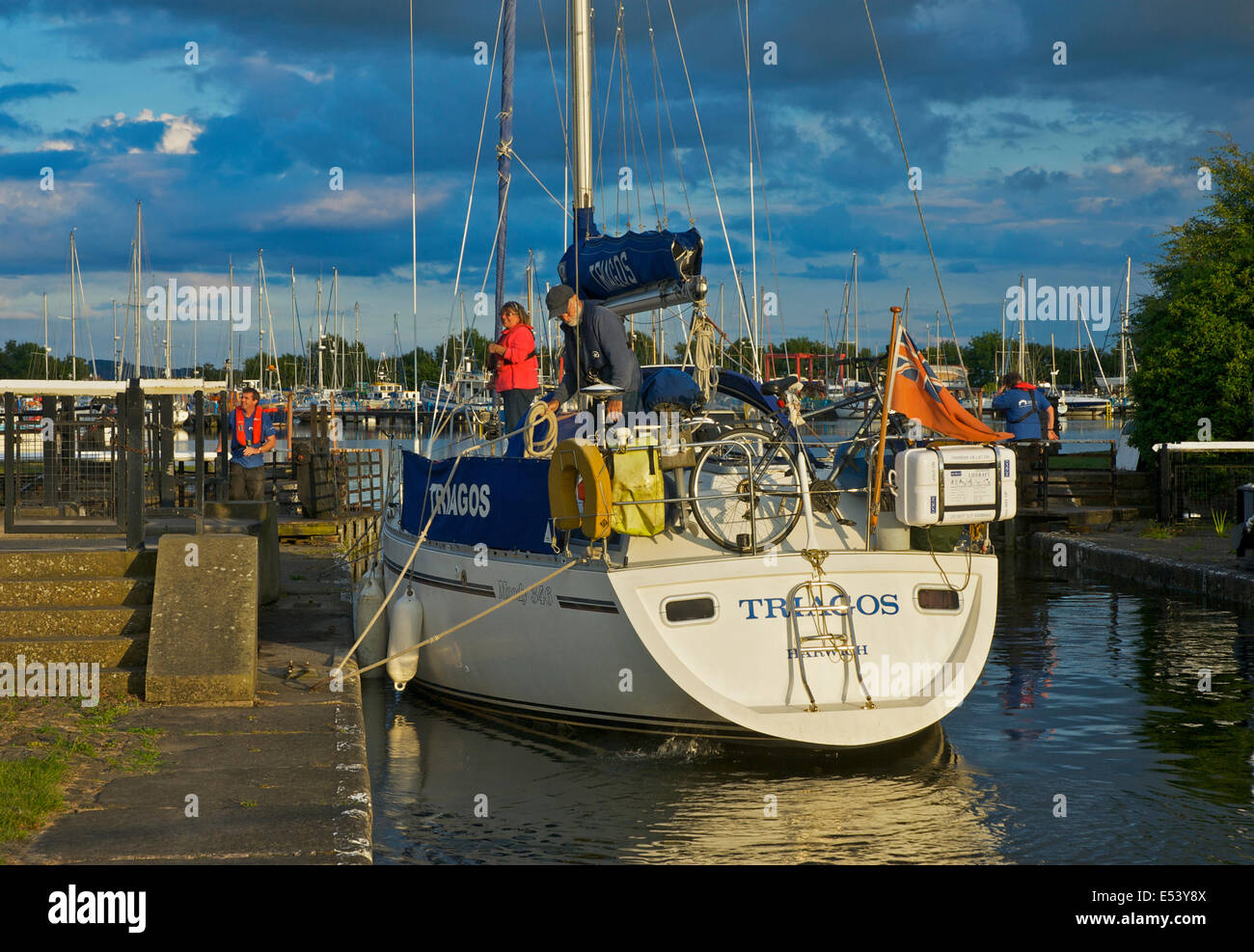 Sailing boat being manoevred through lock at Glasson Dock, Lancashire, England UK Stock Photo