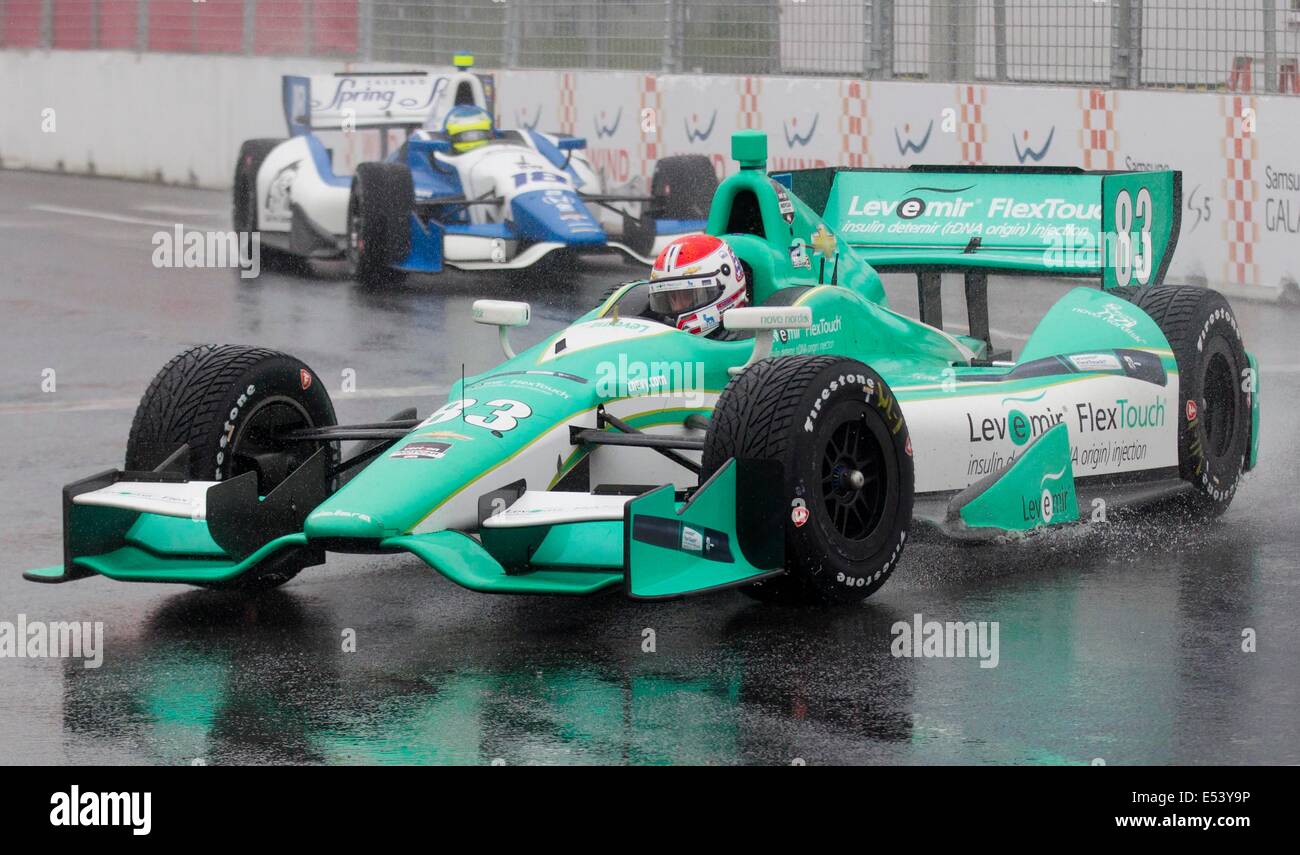 Toronto, Canada. 20th July, 2014. Chip Ganassi Racing Teams' American driver Charlie Kimball (R) races during the 2014 Honda Indy Toronto of IndyCar Series race in Toronto, Canada, July 19, 2014. The Indy car race was later cancelled due to rain on Saturday. Credit:  Xinhua/Alamy Live News Stock Photo