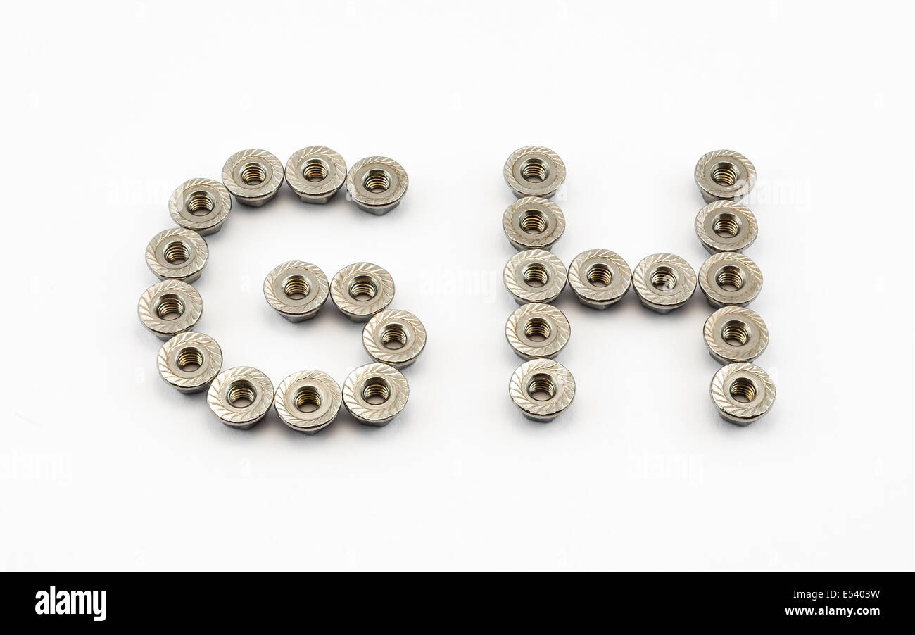 G and H Alphabet, Created by Stainless Steel Hex Flange Nuts. Stock Photo