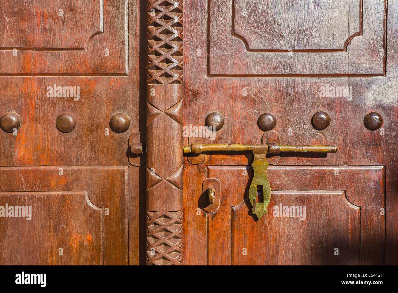 old lock on a wooden carved door Stock Photo - Alamy