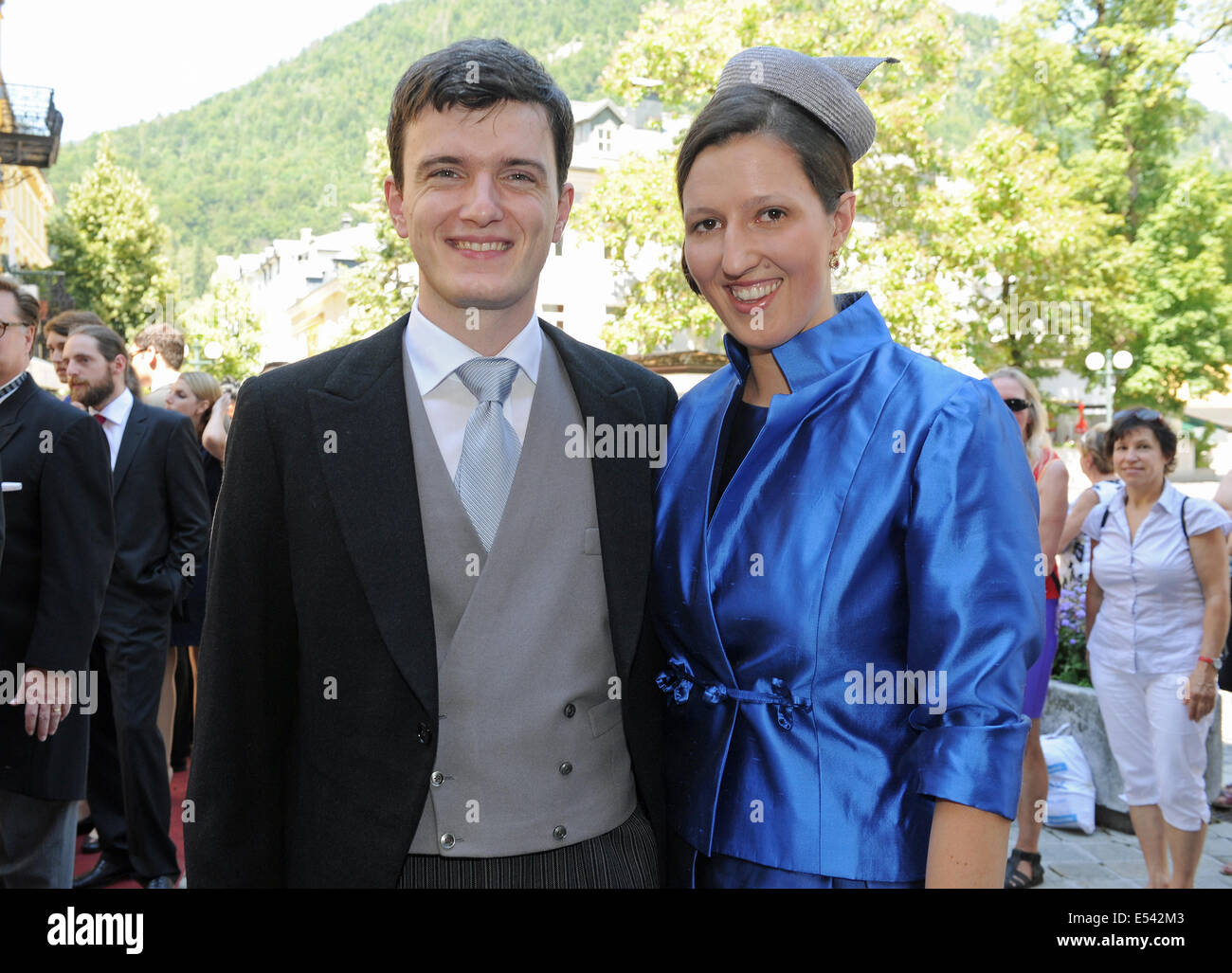 Bad Ischl, Austria. 19th July, 2014. The brother of the bride Valentin  Habsburg-Lorraine (L) and his fiancée Claudia Mittermayr arrive for the  wedding ceremony of the bridal couple Maria Sophie Habsburg-Lorraine and