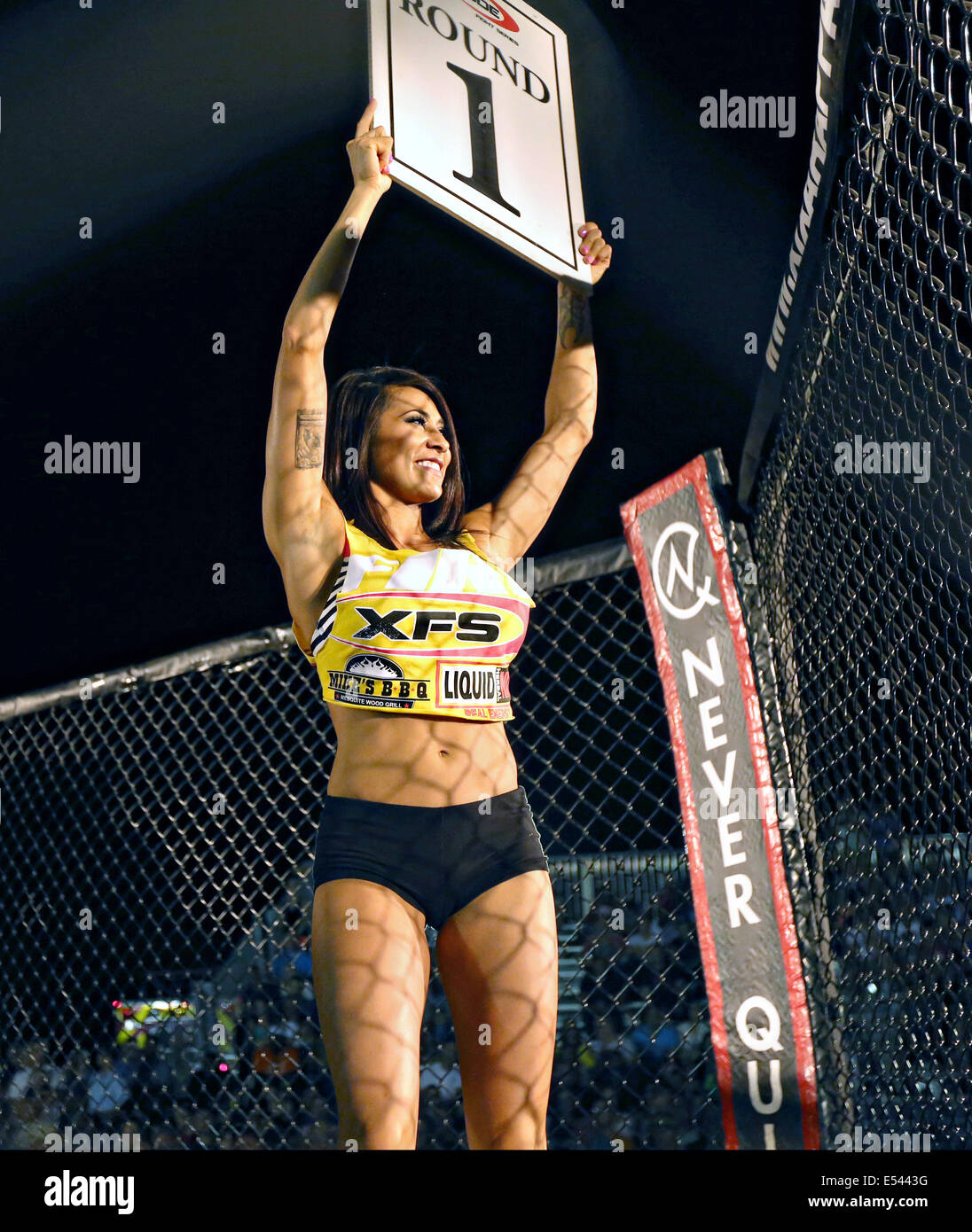 Cage Fighting ring girl Taniah marks the first round start of a fight round during Summer Fight Night Mixed Martial Arts competition at Del Valle Field June 20, 2014 in Twentynine, California. Stock Photo
