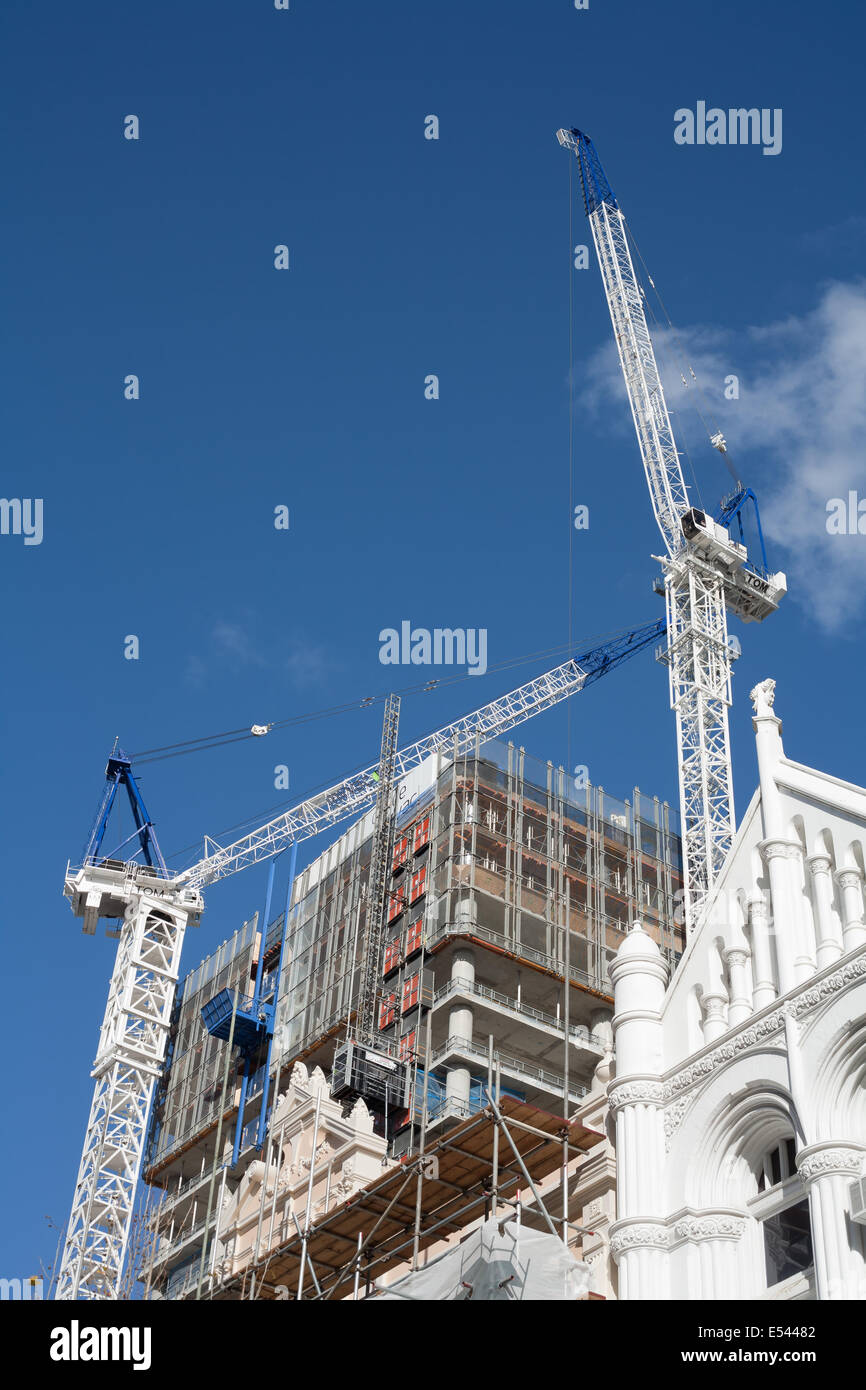 Cranes being used in the construction of a new skyscraper Stock Photo