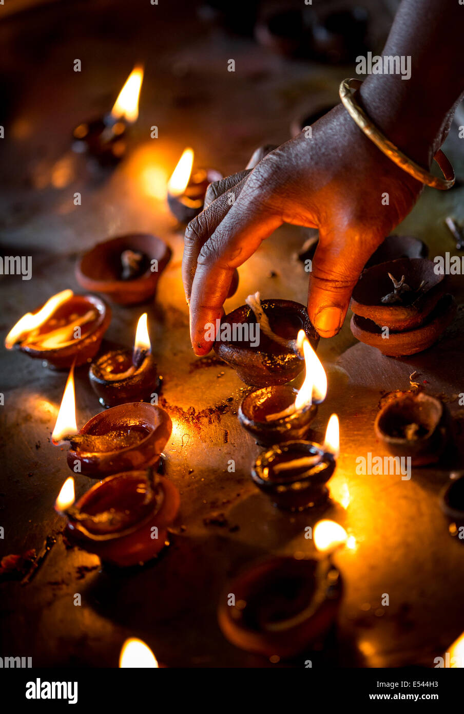 Burning candles in the Indian temple. Diwali – the festival of lights. Stock Photo