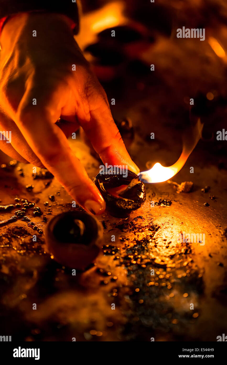 Burning candles in the Indian temple. Diwali – the festival of lights. Stock Photo