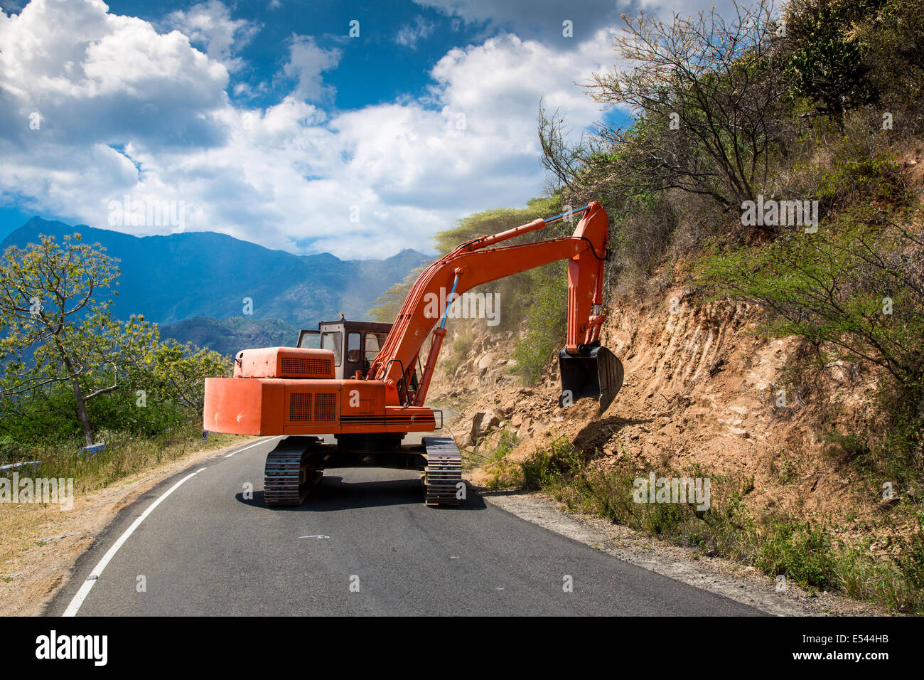 Road works. Excavator repair the road. Stock Photo