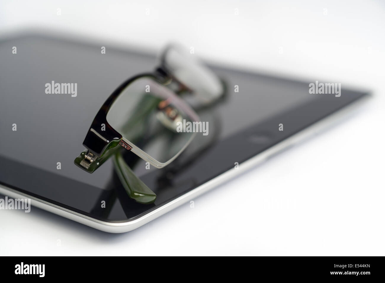 iPad and reading glasses Stock Photo Alamy